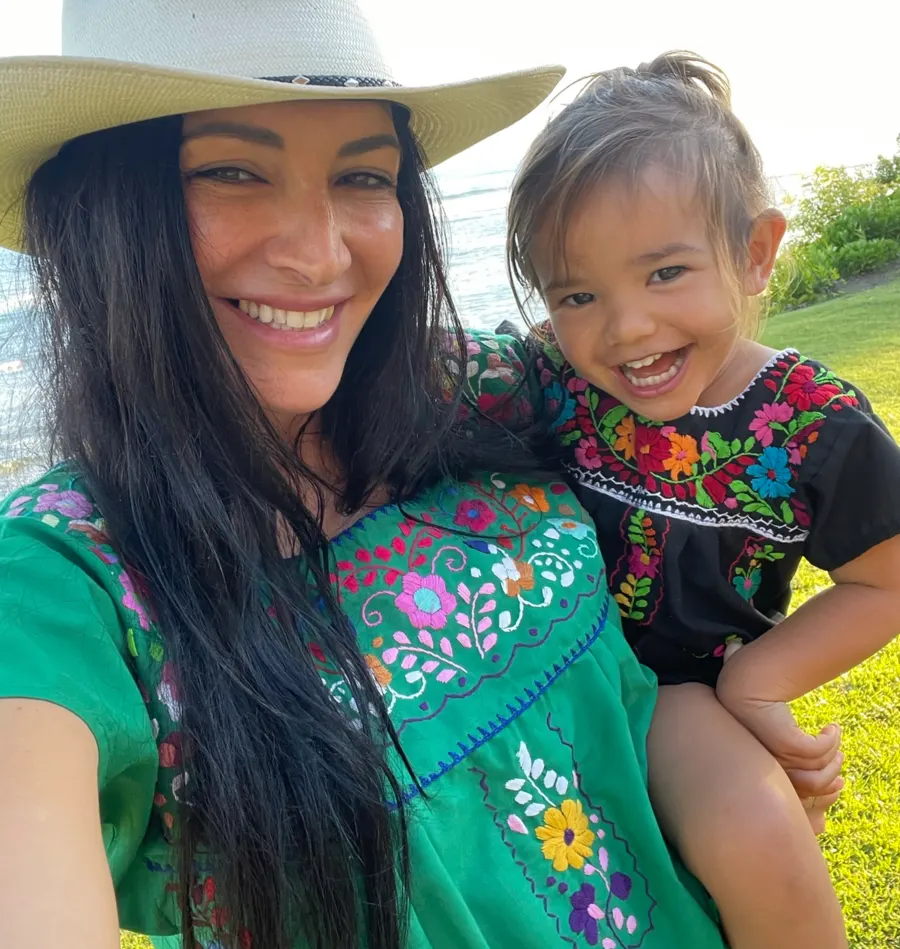 Brandee Sabella with a child outdoors