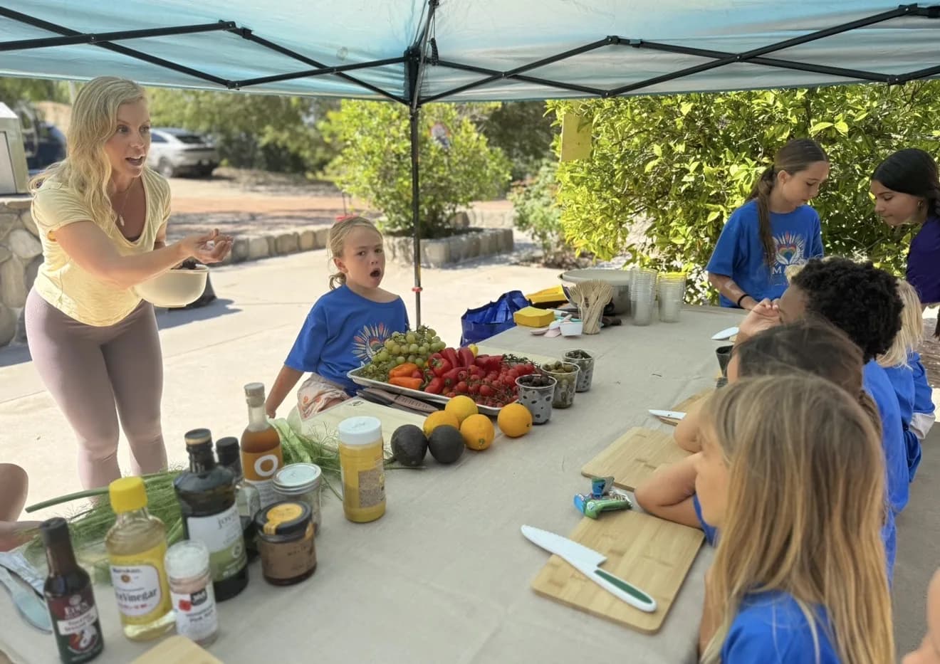 Children preparing a meal together outdoors