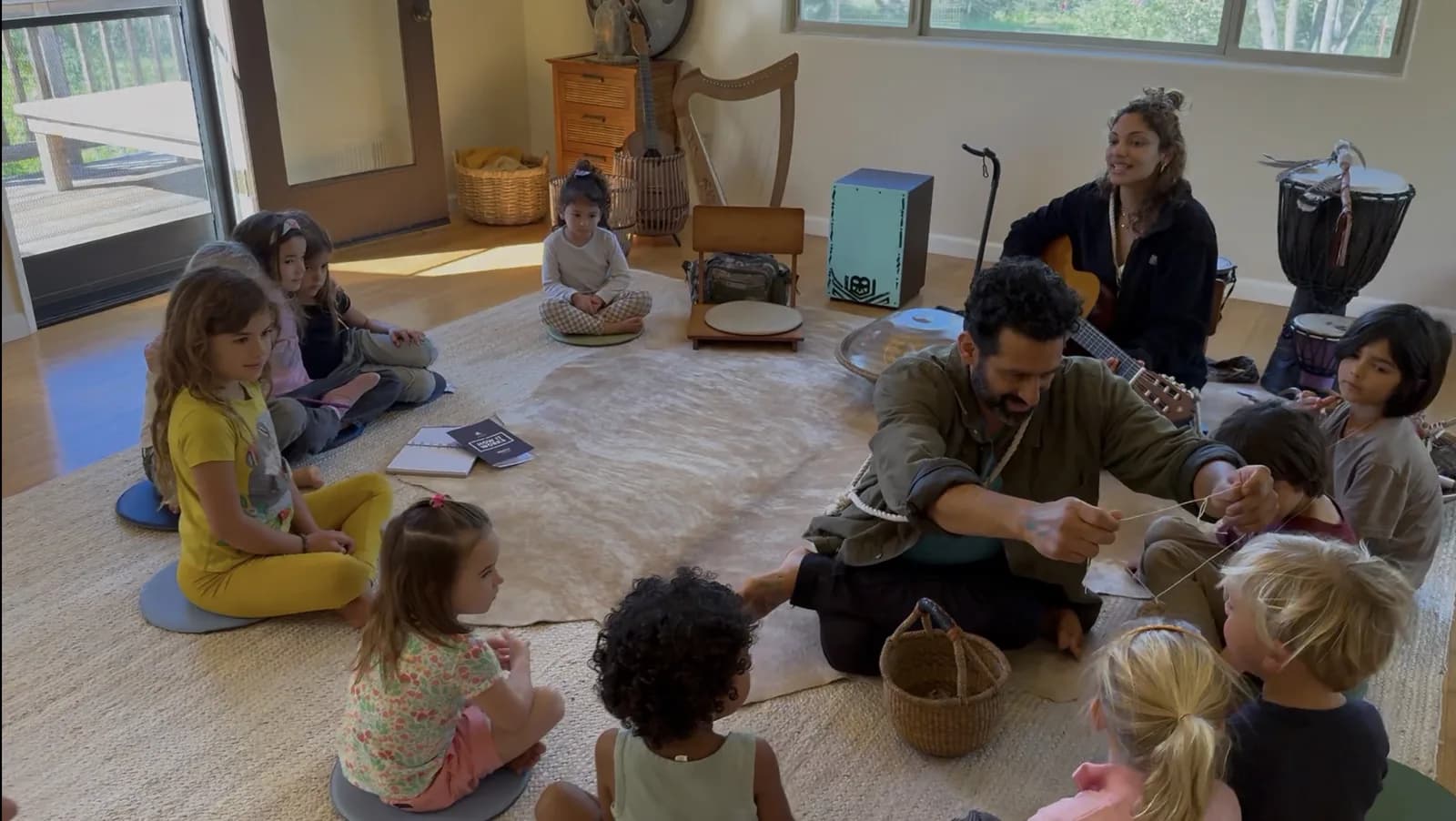 A wide view of a MANA music and storytelling circle