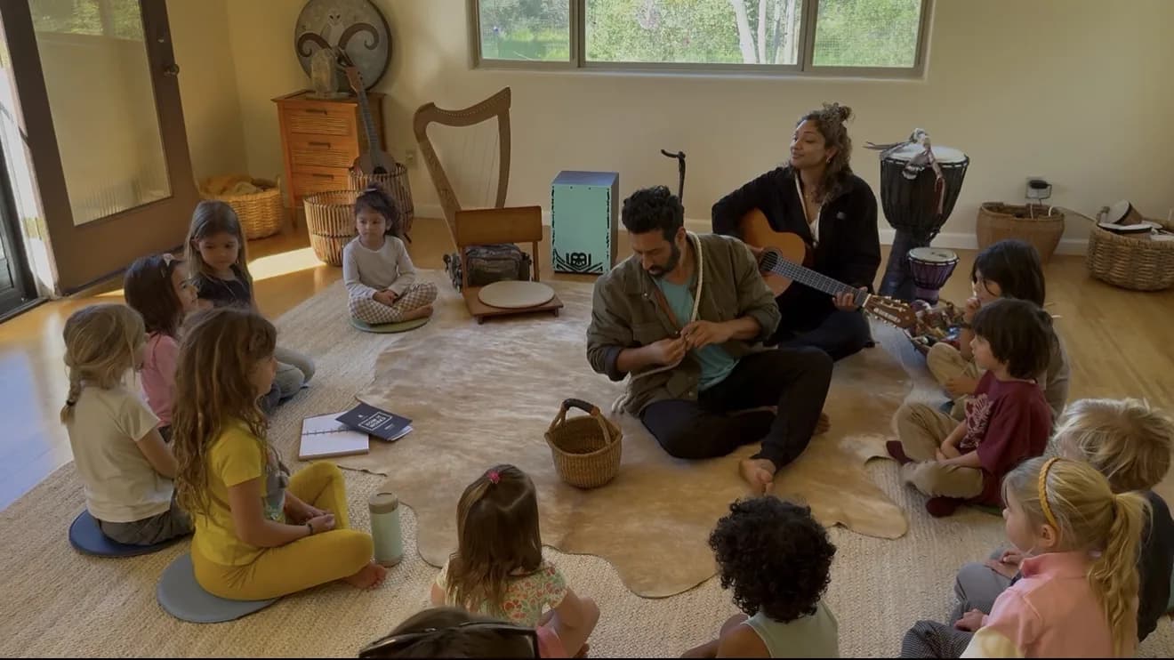 Children and musicians sharing rhythm and song in a circle