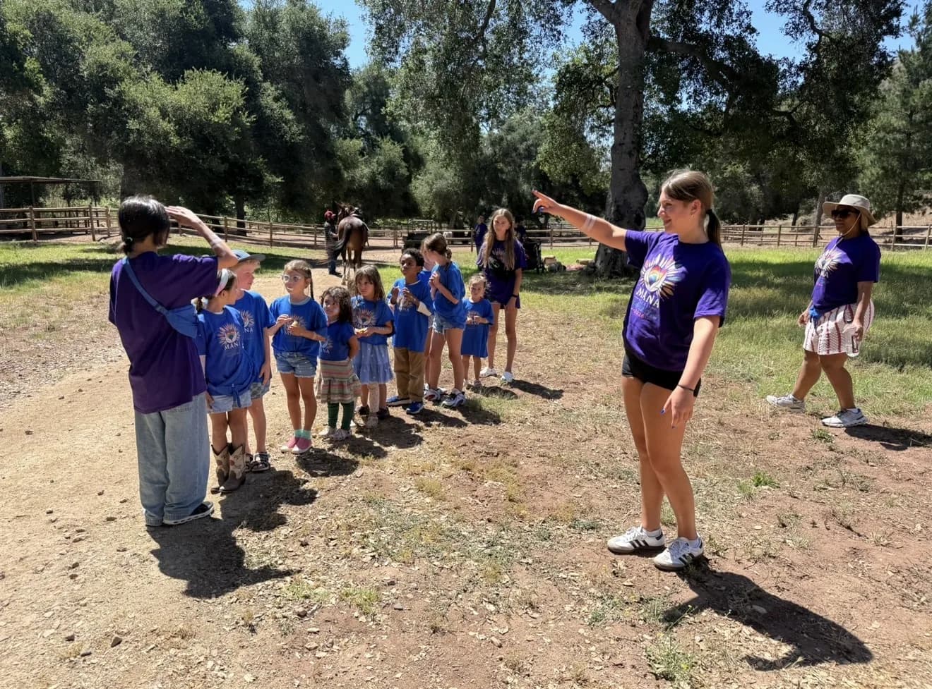 Children gathered with their guides for an outdoor group activity
