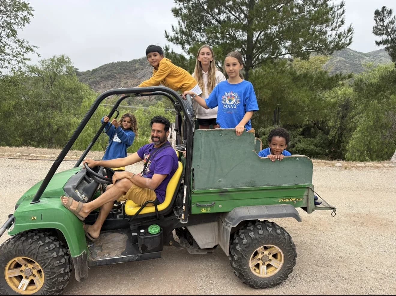 Children and guides traveling together across the ranch